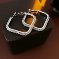 Silver square hoop earrings with sparkling crystal accents on a leather display - Silver Square Large Hoops with Textured Border