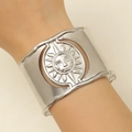Detailed view of silver sun relief cuff bracelet with wavy edges on wrist - Apollo Relief Silver (7096)