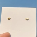 Minimalist gold evil eye stud earrings with blue gemstone on white card display - 925 Silver Needle / Gold Evil Eye