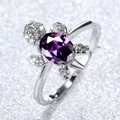 Exquisite turtle ring featuring a large purple oval gemstone and sparkling white crystals - Purple Zirconia