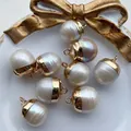 Baroque pearl pendant with golden acorn cap and natural iridescent texture - No.37 Width 12-15mm
