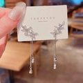 Detail of silver long tassel earrings with flower motifs and teardrop crystals - E1652 Silver
