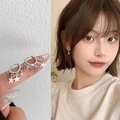 Silver star hoop earrings with dangling solid and hollow charms shown on model - Silver Star Pendant