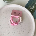 Pink and white gradient spiral hair ties on a ceramic tray for a stylish daily look - Two-tone Pink Single Thick
