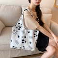 White canvas tote bag featuring cute panda prints and spacious interior for daily use - White Canvas Panda