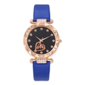 Detail of rose gold starry sky watch face with Love script and navy leather strap - Blue