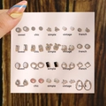 Chic earring set featuring pearl and rhinestone studs displayed on white card board - E0074-1 (Silver Fashion Set)