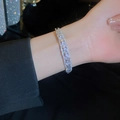 Elegant silver butterfly bangle set with pear-shaped cubic zirconia on a wrist - Silver Teardrop Double Layer