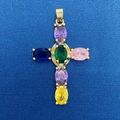 Golden cross pendant with multi-colored crystals on blue textured fabric background - Colorful Oval Zircon Cross Pendant (761)