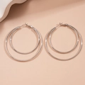 Detail view of double-layered silver geometric metal hoop earrings with leverback closure - Silver