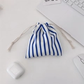 Blue and white striped drawstring organizer bag on a desk with office accessories - Royal Blue Stripes