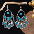 Detail of bohemian silver tassel earrings with turquoise beads hanging on a branch - Antique Silver + Teardrop Turquoise Tassel (E5775-4)