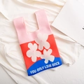 Knit tote bag in pink blue red with white flowers and You Only Live Once slogan - Pink-Flower