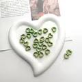 DIY ceramic heart beads in light green with brownish ink wash texture for jewelry making - Green with Red Spots