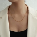 Elegant 18k gold plated stainless steel y2k layered tassel necklace worn on a model - Short Style / Gold