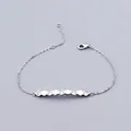 Detail of minimalist silver hexagonal bracelet with sparkling cubic zirconia settings - Bracelet / White Gold