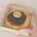 Basque cheesecake in white square box with transparent lid and pink ribbon detail - 4 Inch Off-White Transparent Basque Box