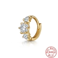 Macro view of gold S925 silver huggie earring with three sparkling gradient zircons - Gold #2