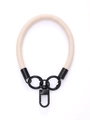 Detail view of the beige leather phone wrist strap with black metal swivel clasp - Beige