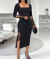 Detail of elegant black slim dress with lace patchwork sleeves and side slit accents - S / Black