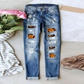 Damesjeans in middenblauw met Halloween-pompoen- en schedelpatches en ripped denim details - S / Blauw