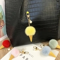 Detailed view of cute plush ice cream keychains with pearl charms in multiple pastel colors - Single Piece / Yellow