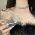 Close-up of a silver rhinestone choker necklace worn by a model in a party setting - 38# Necklace - Silver - Three-layer