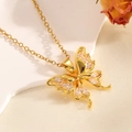 Detailed close-up of a gold bow pendant with sparkling crystals on white satin - Gold Double Layer Bowknot Necklace