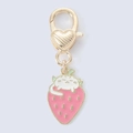 Detailed close-up of a golden cat and strawberry charm with a heart-shaped clasp - Pink Strawberry Cat