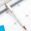 Elegant white marble retractable ballpoint pen with rose gold metal accents and clip - Marbled White