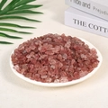 Polished irregular pink strawberry crystal stones displayed in a white ceramic dish - Strawberry Quartz (7-9mm) 100g