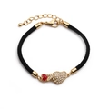 Detailed view of woven bracelet with gold hand sign charm and adjustable lobster clasp - Hand Heart Gesture + Black Rope