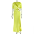Detail view of waist cutout and side slit on the lime green slim-fit knit dress - S / Yellow-Green