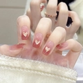 Faux ongles dégradés roses avec accents de cœur pailleté et finition gel brillante - Pêche Cœur Doré (BS2021)