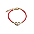 Detailed view of adjustable red braided rope bracelet with golden heart pendant and zircon - Footprint Heart + Red Rope
