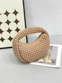Detail of beige woven hobo handbag featuring premium texture and gold metal zipper closure - Khaki