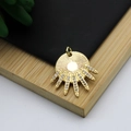 Close-up of a sunburst 18K gold-plated pendant with sparkling zircon inlay details - Sunlight Starburst Style