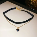 Detail of black velvet choker with double layers and a gold-edged heart pendant - Black