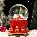 Christmas snow globe with red train base and Santa Claus figurine inside a glass sphere - Santa Claus (2041) / 8cm Music + Light