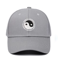 Detailed embroidery of Tai Chi Yin Yang symbol and Swimming text on gray baseball cap - Adjustable / Gray