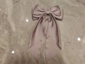 Oversized dusty pink satin bow hair clip with glossy silk finish and spring fastener - Lotus Pink