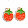 Detailed view of two red strawberry charms with green leaves and gold-plated alloy borders - Round Strawberry
