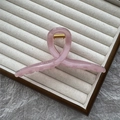 Minimalist jelly pink hair claw clip with twisted ring design on a beige tray - 13cm Ribbon / Jelly Pink