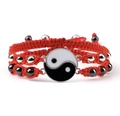 Macro detail of red woven Yin Yang bracelet with magnetic clasp and metal accents - Tai Chi Red Pair