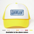 Detail view of DARLIN printed trucker hat showing mesh back and color options - One Size / Yellow