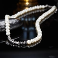Detailed view of freshwater pearl necklace with silver accents on reflective black surface - LN164 Natural Pearl Silver Necklace (Silver)