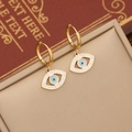 Goldene Evil Eye Creolen mit funkelnden Kristallen und blauem Augen-Detail - Ohrringe / Gold
