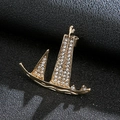 Men's fashion golden sailboat lapel pin with sparkling crystals on black leather - Sail Gold