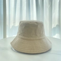 Detail of cream terry cloth bucket hat texture and soft fabric on marble surface - M (56-58cm) / Khaki
