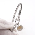 Silver twisted cable bracelet featuring a U-shaped hook clasp and round medal pendant - Gen 1 #Tag / Silver